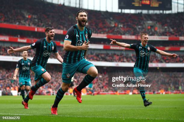 Charlie Austin of Southampton celebrates scoring his sides second goal during the Premier League match between Arsenal and Southampton at Emirates...