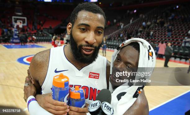 Andre Drummond and Reggie Jackson of the Detroit Pistons celebrate a win over the Dallas Mavericks at Little Caesars Arena on April 6, 2018 in...