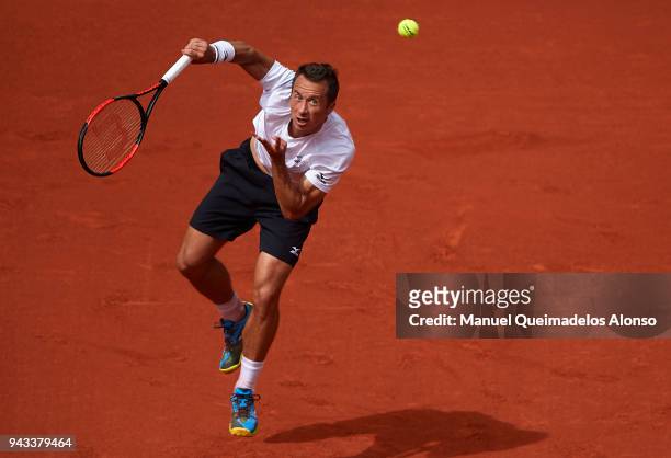 Philipp Kohlschreiber of Germany serves during his match against David Ferrer of Spain during day three of the Davis Cup World Group Quarter Final...
