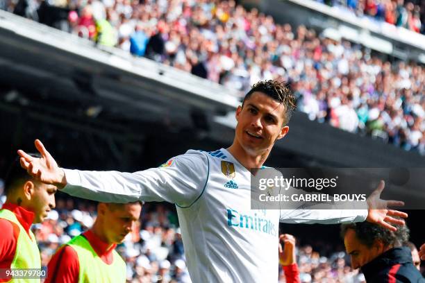 Real Madrid's Portuguese forward Cristiano Ronaldo celebrates after scoring a goal during the Spanish league football match between Real Madrid CF...