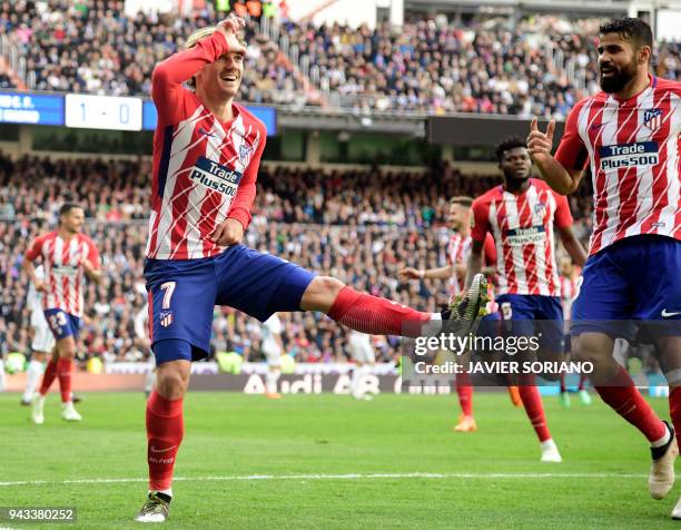 Atletico Madrid's French forward Antoine Griezmann celebrates a goal during the Spanish league football match between Real Madrid CF and Club...