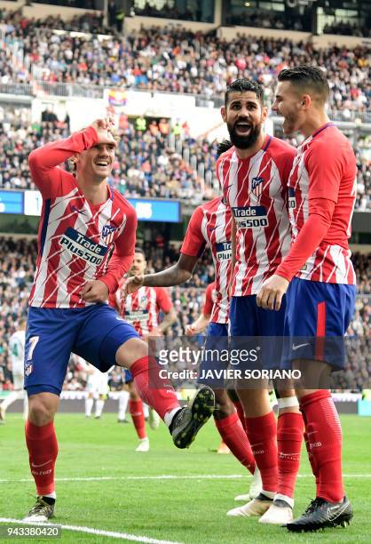 Atletico Madrid's French forward Antoine Griezmann celebrates a goal during the Spanish league football match between Real Madrid CF and Club...