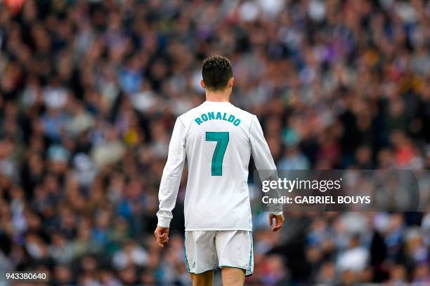 Real Madrid's Portuguese forward Cristiano Ronaldo walks on the pitch during the Spanish league football match between Real Madrid CF and Club...