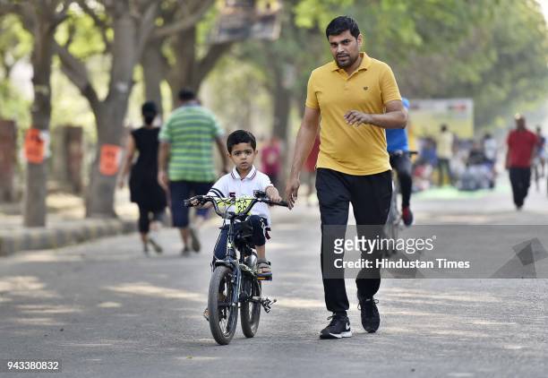 People participate during Raahgiri day at Palam Vihar, an event organized by MCG, on April 8, 2018 in Gurugram, India. Various activities seen such...