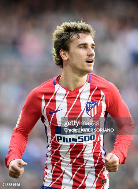 Atletico Madrid's French forward Antoine Griezmann celebrates a goal during the Spanish league football match between Real Madrid CF and Club...