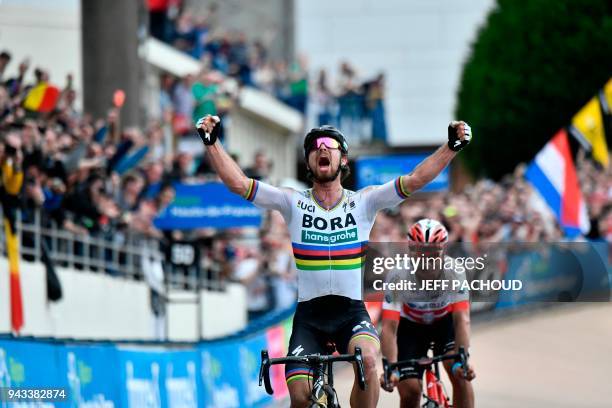 Slovakia's Peter Sagan celebrates winning ahead of Switzerland's Silvan Dillier during the 116th edition of the Paris-Roubaix one-day classic cycling...