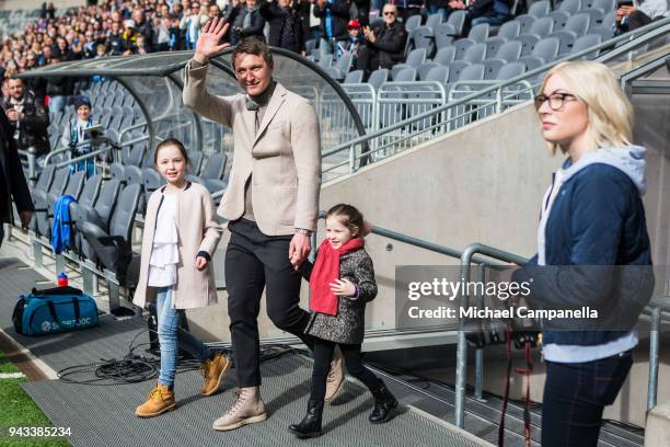 Former Djurgardens IF captain Kim Kallstrom enters the pitch with daughters Zoe and Bianca before an Allsvenskan match between Djurgardens IF and...