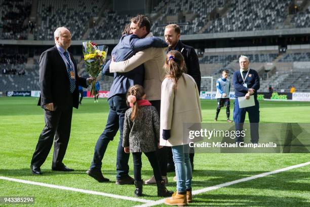 Former Djurgardens IF captain Kim Kallstrom is given a framed jersey by sporting director Bosse Andersson before an Allsvenskan match between...