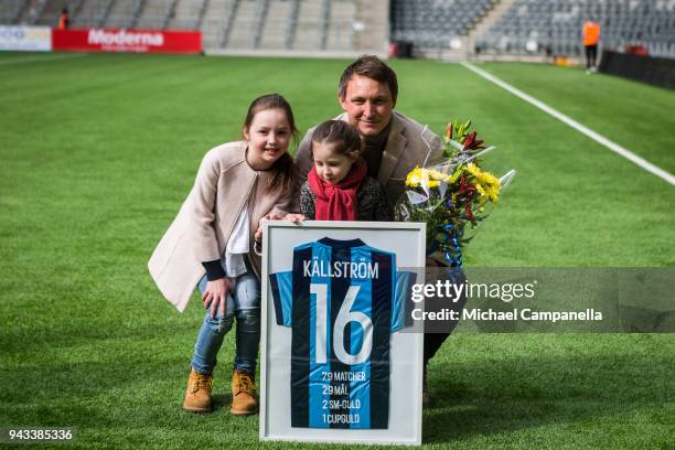 Former Djurgardens IF captain Kim Kallstrom for a picture with his daughters Zoe and Bianca along with a framed commemorative jersey before an...