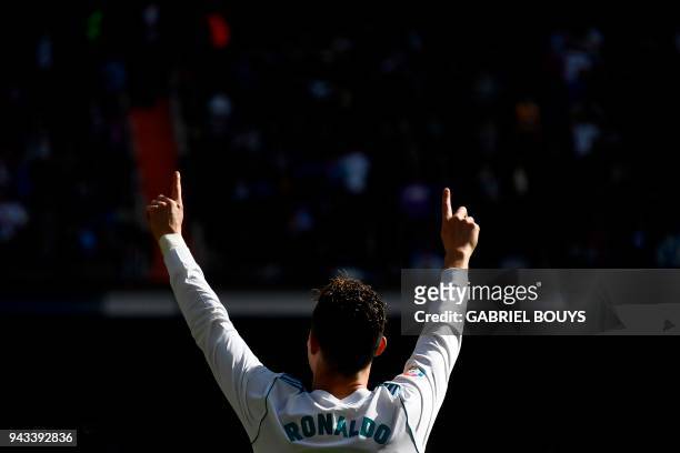 Real Madrid's Portuguese forward Cristiano Ronaldo celebrates after scoring a goal during the Spanish league football match between Real Madrid CF...