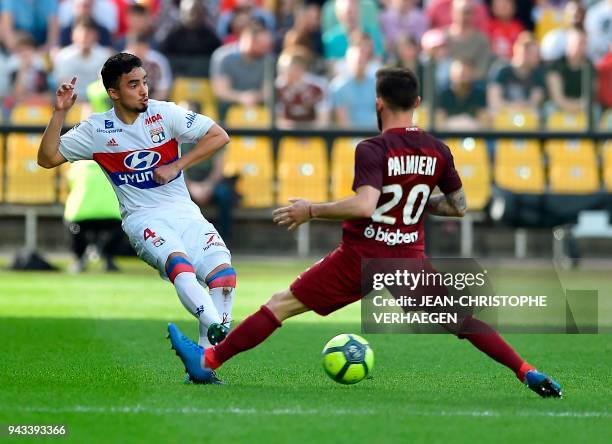 Metz's French defender Julian Palmieri vies for the ball with Lyon's Brazilian defender Rafael da Silva during the French L1 football match between...