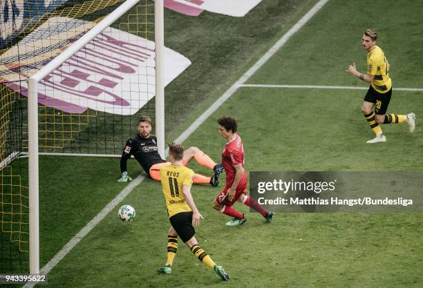 Maximilian Philipp of Dortmund scores his team's third goal past goalkeeper Ron-Robert Zieler of Stuttgart during the Bundesliga match between...