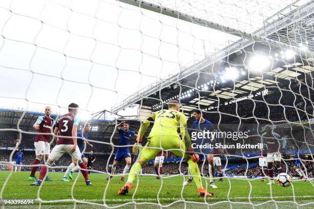 Cesar Azpilicueta of Chelsea scores his sides first goal past Joe Hart of West Ham United during the Premier League match between Chelsea and West...