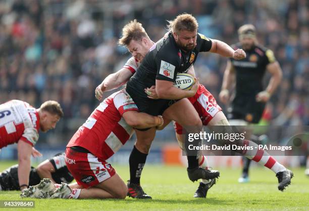 Exeter's Tomas Francis is tackled by Gloucester's Josh Hohneck and Tom Savage during the Aviva Premiership match at Sandy Park, Exeter.