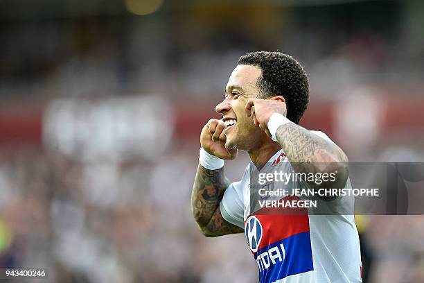 Lyon's Dutch forward Memphis Depay celebrates after scoring a goal during the French L1 football match between Metz and Lyon on April 8, 2018 at...