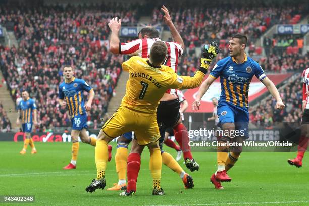 Shrewsbury goalkeeper Dean Henderson is knocked unconscious after colliding with Matt Rhead during the Checkatrade Trophy Final between Lincoln City...