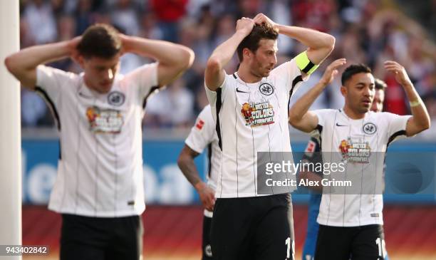 Luka Jovic, David Abraham and Marco Fabian of Frankfurt react during the Bundesliga match between Eintracht Frankfurt and TSG 1899 Hoffenheim at...