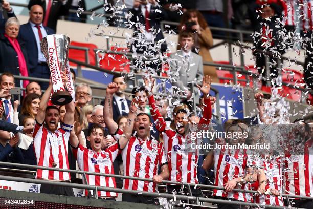 Luke Waterfall of Lincoln lifts the trophy after victory during the Checkatrade Trophy Final between Shrewsbury Town and Lincoln City at Wembley...