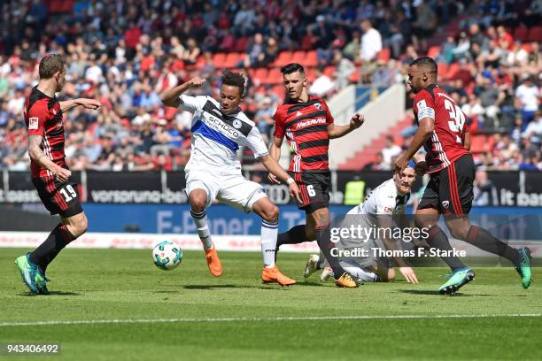 Marcel Gaus , Alfredo Morales and Marvin Matip of Ingolstadt tackle Roberto Massimo of Bielefeld during the Second Bundesliga match between FC...