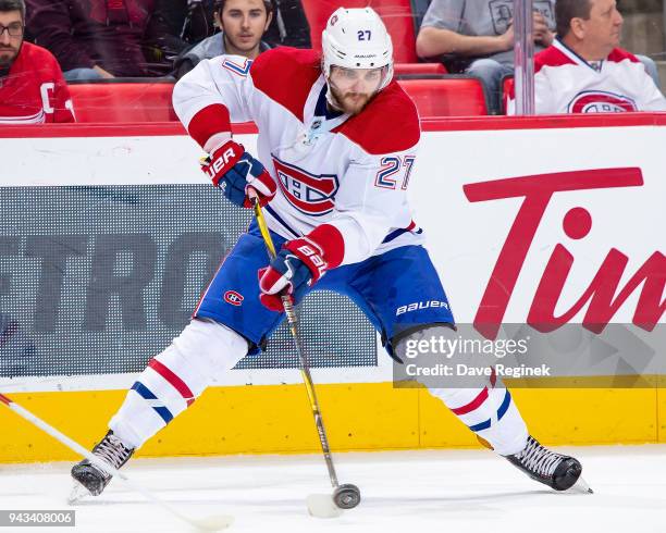 Alex Galchenyuk of the Montreal Canadiens controls the puck against the Detroit Red Wings during an NHL game at Little Caesars Arena on April 5, 2018...