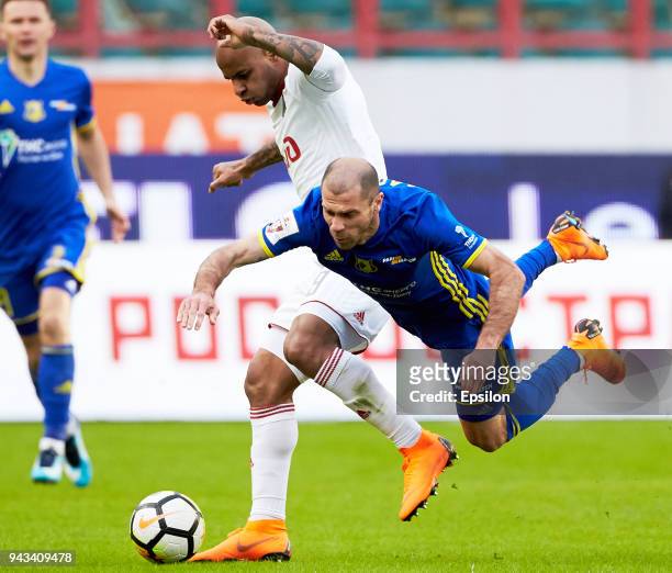Ari of FC Lokomotiv Moscow and Timofei Kalachev of FC Rostov Rostov-on-Don vie for the ball during the Russian Football League match between FC...