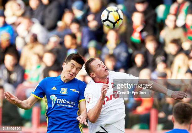 Dmitri Tarasov of FC Lokomotiv Moscow and Eldor Shomurodov of FC Rostov Rostov-on-Don vie for the ball during the Russian Football League match...