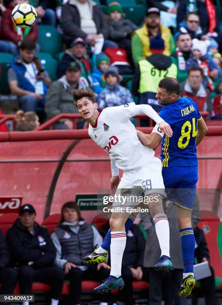 Aleksei Miranchuk of FC Lokomotiv Moscow and Alexandru Gatcan of FC Rostov Rostov-on-Don vie for the ball during the Russian Football League match...