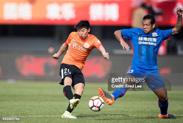 Cao Yongjing of Beijing Renhe and Fredy Guarin of Shanghai Shenhua in action during teh 2018 Chinese Super League match between Beijing Renhe and...