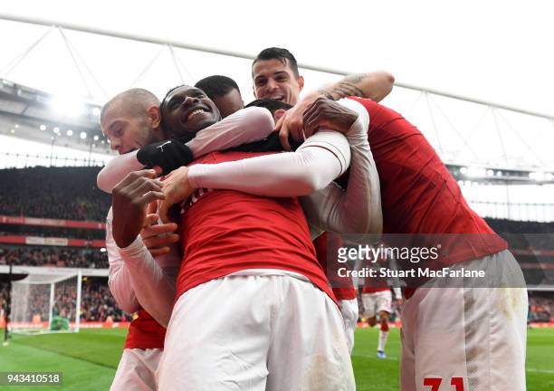 Danny Welbeck celebrates scoring the 3rd Arsenal goal with Jack Wilshere, Granit Xhaka and Sead Kolasinac during the Premier League match between...