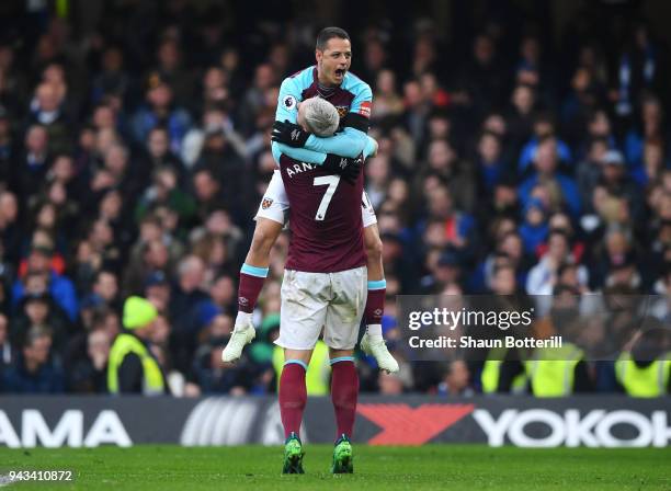 Javier Hernandez of West Ham United celebrates with team mate Marko Arnautovic of West Ham United after scoring his sides first goal during the...