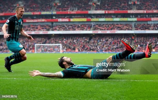 James Ward-Prowse and Charlie Austin of Southampton celebrate during the Premier League match between Arsenal and Southampton at Emirates Stadium on...