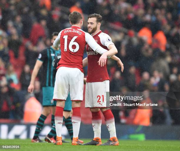 Rob Holding and Calum Chambers of Arsenal after the Premier League match between Arsenal and Southampton at Emirates Stadium on April 8, 2018 in...