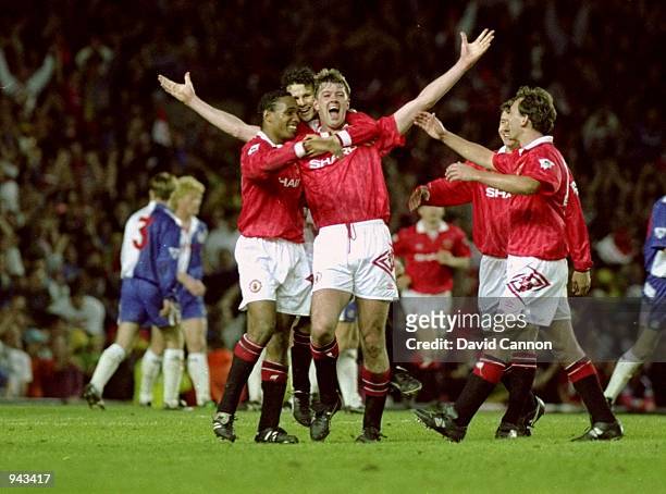 Gary Pallister of Manchester United celebrates his goal against Blackburn Rovers with team mates during the FA Carling Premier League match at Old...