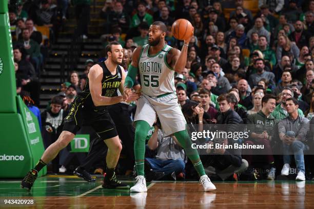 Greg Monroe of the Boston Celtics handles the ball against Miles Plumlee of the Atlanta Hawks on April 8, 2018 at the TD Garden in Boston,...