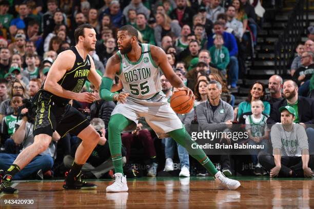 Greg Monroe of the Boston Celtics handles the ball against Miles Plumlee of the Atlanta Hawks on April 8, 2018 at the TD Garden in Boston,...