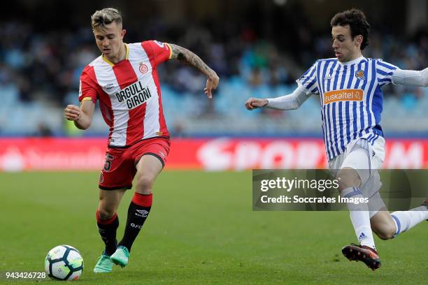 Pablo Maffeo of Girona, Ruben Pardo of Real Sociedad during the La Liga Santander match between Real Sociedad v Girona at the Estadio Anoeta on April...