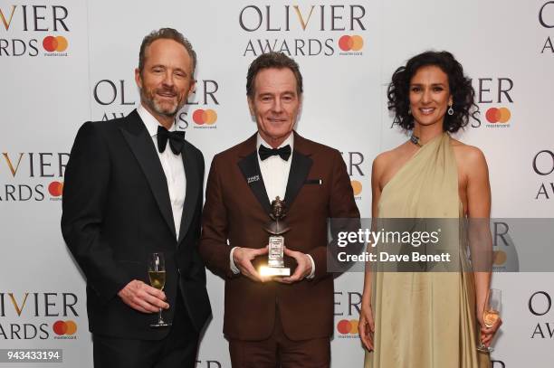 John Benjamin Hickey, Bryan Cranston, winner of the Best Actor award for "Network", and Indira Varma pose in the press room during The Olivier Awards...