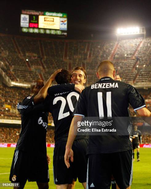 Gonzalo Higuain of Real Madrid celebrates with Karim Benzema , Sergio Ramos and Lassana Diarra during the La Liga match between Valencia and Real...