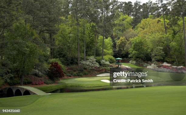 General view is seen as Xander Schauffele of the United States putts on the the 12th green during the final round of the 2018 Masters Tournament at...