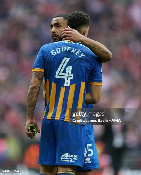 Dejected Stefan Payne of Shrewsbury Town embraces Ben Godfrey at full time after the Checkatrade Trophy Final between Lincoln City and Shrewsbury...