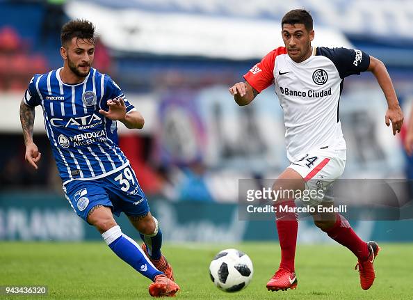 Franco Moyano of San Lorenzo fights for the ball with Jalil Elias of ...