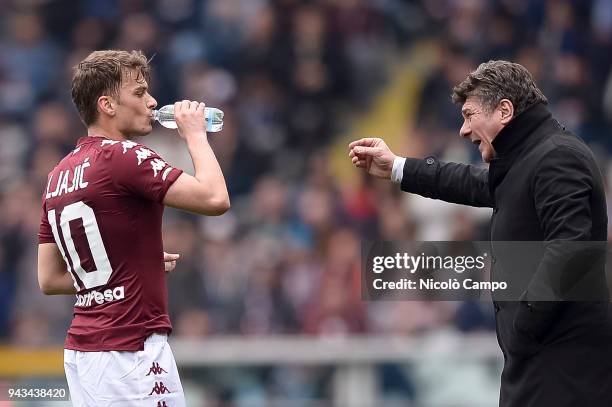 Walter Mazzarri , head coach of Torino FC, speaks with Adem Ljajic of Torino FC during the Serie A football match between Torino FC and FC...