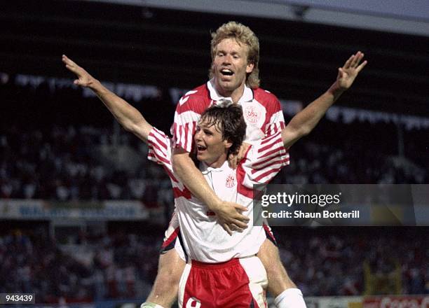 Flemming Avlsen and Henrik Andersen of Denmark celebrate during the European Championship Group 1 match against France at the Malmo Stadium in Malmo,...