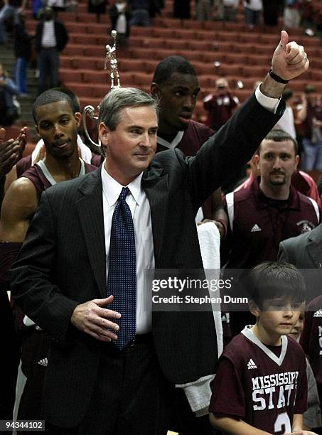 Head coach Rick Stansbury of the Mississippi State Bulldogs gives a thumbs up after the game with the UCLA Bruins in the John Wooden Classic on...