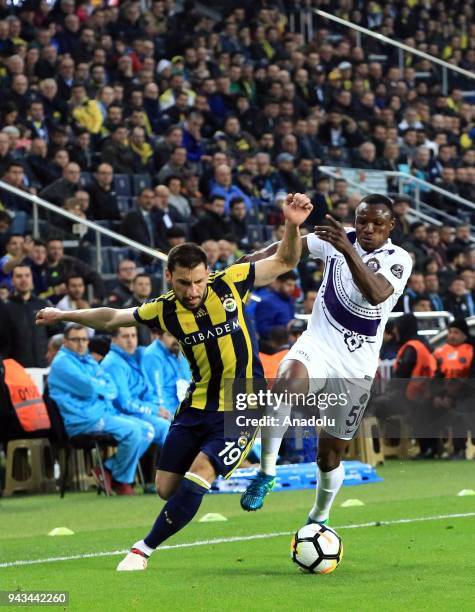 Sener Ozbayrakli of Fenerbahce in action against Aminu Umar of Osmanlispor during the Turkish Super Lig football match between Fenerbahce and...