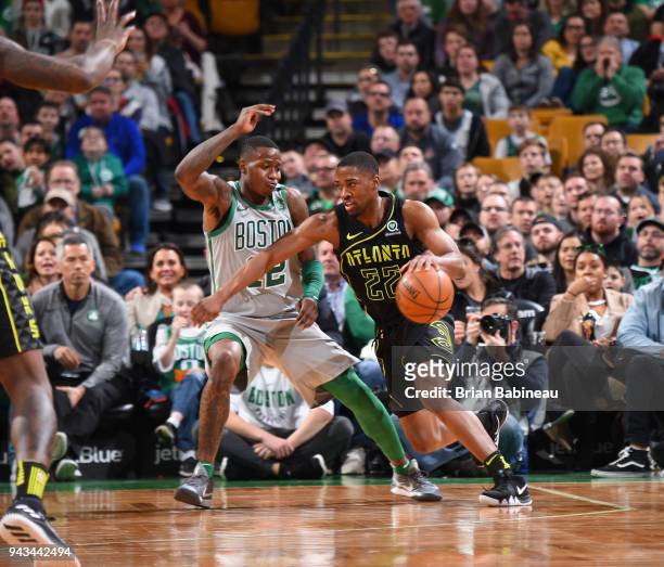 Isaiah Taylor of the Atlanta Hawks handles the ball against Al Horford of the Boston Celtics on April 8, 2018 at the TD Garden in Boston,...