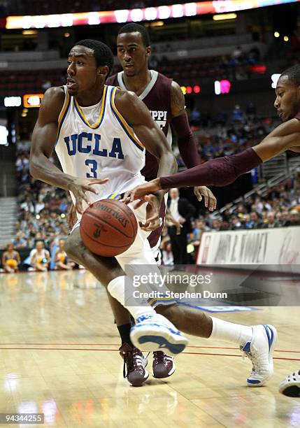 Malcolm Lee of the UCLA Bruins has the ball stropped by Barry Steward of the Mississippi State Bulldogs in the John Wooden Classic on December 12,...