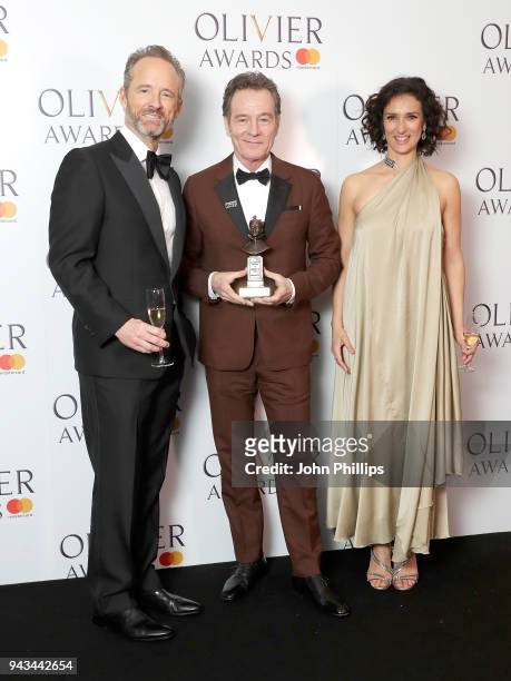 John Benjamin Hickey, Bryan Cranston, winner of the Best Actor award for 'Network', and Indira Varma pose in the press room during The Olivier Awards...