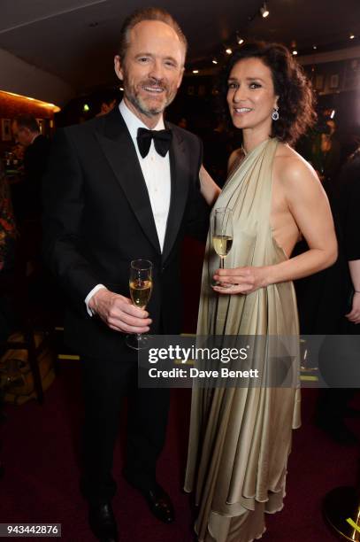 John Benjamin Hickey and Indira Varma pose in the press room during The Olivier Awards with Mastercard at Royal Albert Hall on April 8, 2018 in...