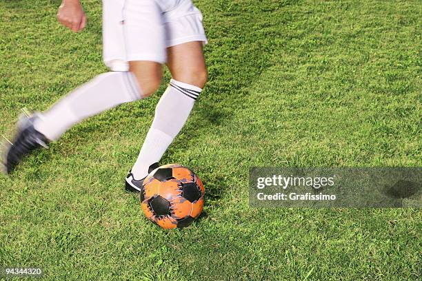 soccer player about to kick a ball - premier league ball on pitch stock pictures, royalty-free photos & images